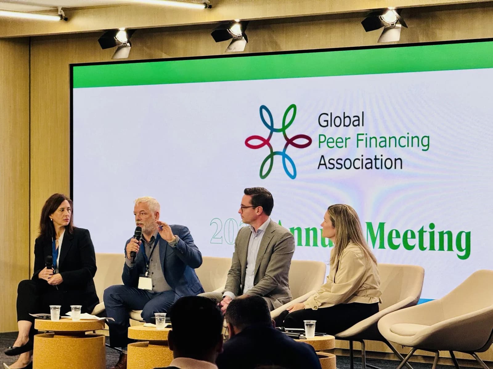 Four panelists discussing member priorities at a GPFA meeting in Montreal.